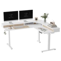 two computer monitors sitting on top of a white desk