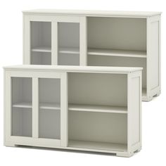 two white bookcases with glass doors on each side