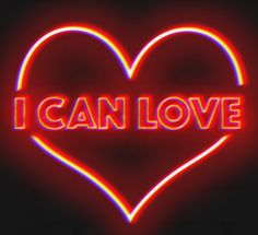 i can love neon sign in the shape of a heart on a black background photo