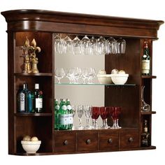 an entertainment center with wine glasses and bottles