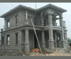 a large gray building sitting on top of a pile of rubble