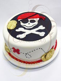 a decorated cake with a skull and crossbones on it