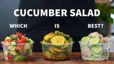 three plastic containers filled with different types of salads on top of a wooden table