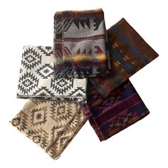 five different colored and patterned blankets