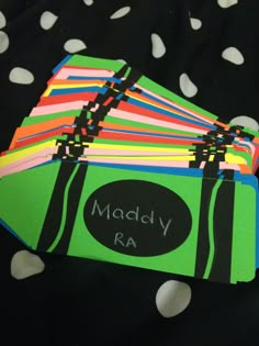 a pile of colorful papers with the name madly ra written on them and polka dots