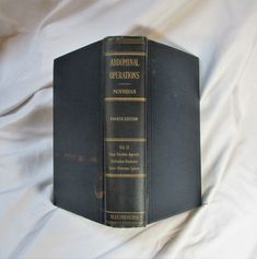 "This old medical book is called \"Abdominal Operations\", and this was published in 1926. This is not a reproduction, not a reprint, and not a digital print ... this is an authentic book of the period. Written by Sir Berkeley Moynihan of England, it was published by W. B. Saunders Company of Philadelphia and London. The hard cover book is in good condition, and this is Volume 2, with all 642 pages here, the binding is secure, and there are many illustrations and diagrams, with an extensive and useful author index and a good subject index. Still useful and readable, and quite interesting as it reveals the state of medical knowledge almost 100 years ago. There's an interesting and unique addition to this book: there's a typewritten note on page 341 discussing an actual operation of 3/6/30 b Vintage Medicine, Anatomy Physiology, Abdominal Surgery, Hard Cover Book, Medicine Book, Medical Knowledge, Book Vintage, Internal Medicine, Cover Book