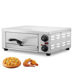 a pizza sitting on top of a counter next to a fryer oven with the lid open