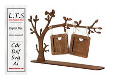 a wooden tree with two tags hanging from it's branches and an ad for car dxf