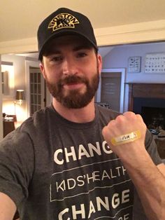 a man with a beard wearing a t - shirt that says change