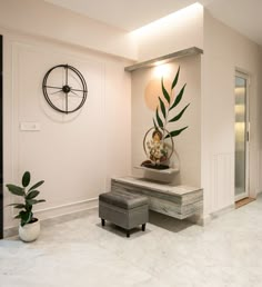 a living room with a clock and plant in the corner on the wall next to it