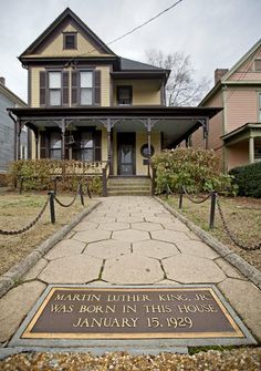 a house with a plaque in front of it