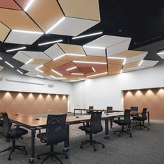 an empty conference room with tables and chairs