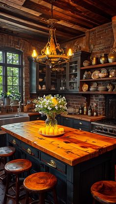 a kitchen with an island and wooden stools