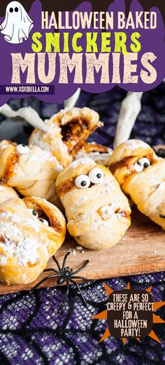 halloween baked snickkers mummies on a wooden board