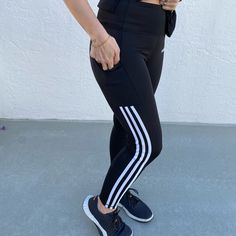 Adidas Tight With Stripes. Black And White. Brand New With Tags. Main Material: 89% Polyester, 11% Spandex. Side Pocket. Adidas Stretch Athleisure Leggings, Adidas Stretch Leggings Athleisure, Adidas Stretch Sporty Leggings, Adidas Sporty Tight Activewear, Tight Adidas Sporty Activewear, Adidas Black Moisture-wicking Leggings, White Stretch Activewear With Three Stripes, Adidas Fitted Sporty Tights, Adidas Compression Athleisure Leggings