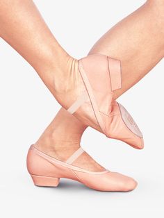 the legs and feet of a woman in ballet shoes