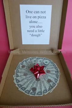 an open box with money in it and a red bow on the lid that says give your graduate a gift