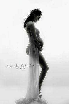 black and white photograph of a pregnant woman