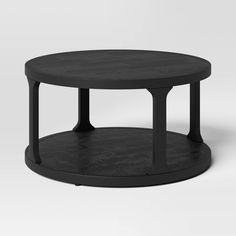 a black coffee table with two circular bases