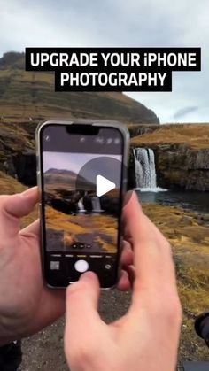 someone holding up their phone to take a photo in front of a waterfall with the caption upgrade your iphone photography