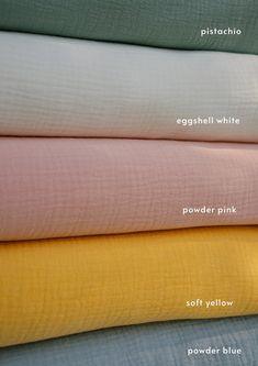 four different colored sheets stacked on top of each other with the names in white, yellow, pink, and blue