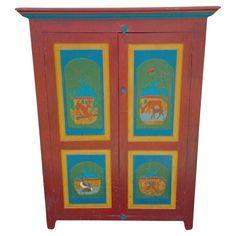 an old wooden cabinet painted with animals on it