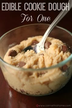 a close up of a spoon in a bowl of food with the words edible cookie dough for one