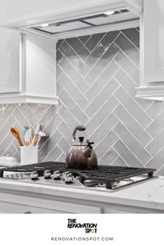 Kitchen Remodel by the Renovation Spot | Grey Herringbone Backsplash for White and Gold Kitchen Remodel | Modern Kitchen Design Modern Grey Kitchen Backsplash, Grey Herringbone Backsplash Kitchen, Kitchen Backsplash Grey And White, White Cabinets Gray Herringbone Backsplash Black Countertops, White And Grey Kitchen Backsplash Ideas, Kitchen Grey Tiles Wall, Dark Grey Herringbone Backsplash, Light Gray Herringbone Backsplash