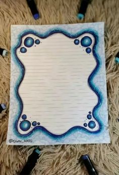 a piece of paper with blue bubbles on it