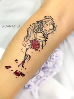 a woman with a rose tattoo on her arm