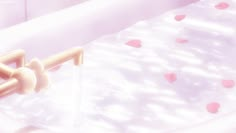 a baby crib with pink hearts on it