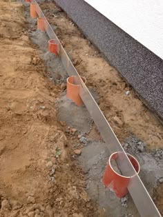 there are some pipes that have been dug in the ground to be used for drainage