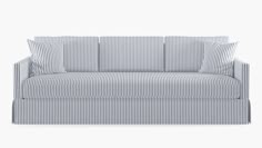 a blue and white striped couch with two pillows on top of the armrests