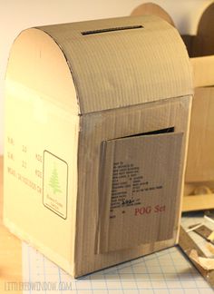 an open mail box sitting on top of a table