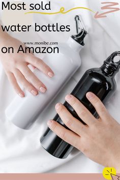 a woman's hand holding a black water bottle with the words most sold water bottles on amazon