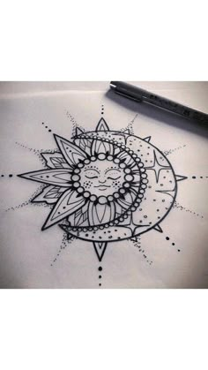 a drawing of a sunflower on paper next to a pen