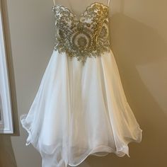 Formal Short White Dress With Gold Rhinestones At The Top. Dress Is Strapless And Ties In The Back. Only Worn Once, Perfect Condition. Size Xxs. White Dress Short Formal, Gold Strapless Dress, White Dress With Gold, Short White Dress, Formal Shorts, White Short Dress, Gold Rhinestone, Top Dress, White Shorts