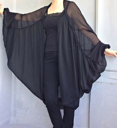 "This black tulle loose kimono is for you! Wide sleeves butterfly design kimono robe could be perfect for so many occasions! This sheer kimono robe comes in a wide and loose style, one size fits all. It adapts to different body types. The summer transparent tunic is made of soft tulle fabric. You can use this black kimono jacket with shorts, jeans, or leggings. The summer kimono cardigan is very unique. Also, it can wear as a beach cover-up in summer. This elegant women's kimono will give the ul Tulle Kimono, Chiffon Kimono Jacket, Black Tulle Top, Loose Kimono, Style Oversize, Sheer Jacket, Sheer Kimono, Chiffon Kimono, Summer Kimono