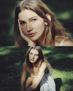 a woman sitting in the grass with her hand on her chin and looking at the camera