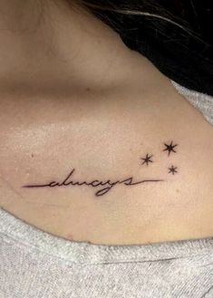 a woman with a tattoo on her shoulder that says, alwayss and stars are in the sky