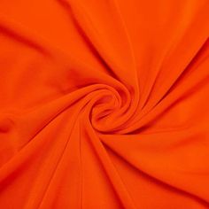 an orange fabric is shown in close up