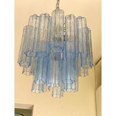 a blue chandelier hanging from the ceiling