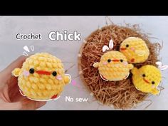 crochet chicks sitting on top of hay next to each other