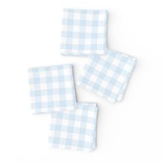 three blue and white checkered napkins on top of each other