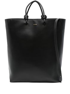 black calf leather smooth grain two top handles knot detailing adjustable detachable shoulder strap logo print to the front main compartment multiple internal slip pockets full lining gold-tone hardware magnetic fastening Jil Sander Bag, Knotted Top, Bags Black, Demi Fine Jewelry, Black Tote, Fine Earrings, Large Tote Bag, Large Bag, Ballet Flat Shoes