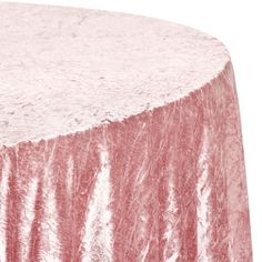 a pink table cloth on top of a round table