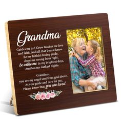 a wooden frame with an image of two children and the words grandma on it