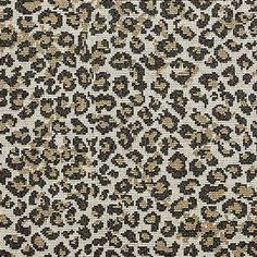 an animal print fabric with brown and black spots