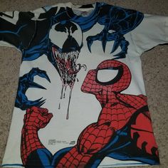 a spiderman t - shirt is on the floor