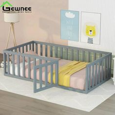 a baby crib in the corner of a room with a lamp and pictures on the wall